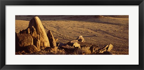 Framed Rocks in a desert, overview of tourist vehicle, Namibia Print