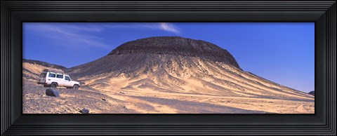 Framed SUV moving in a desert, Black Desert, Bahariya Oasis, Egypt Print