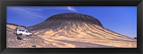 Framed SUV moving in a desert, Black Desert, Bahariya Oasis, Egypt Print