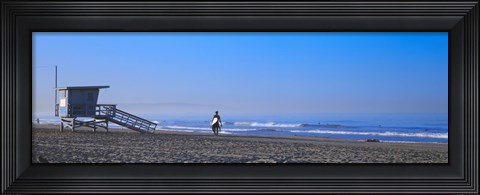Framed Rear view of a surfer on the beach, Santa Monica, Los Angeles County, California, USA Print