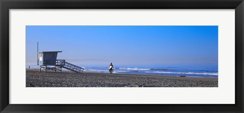 Framed Rear view of a surfer on the beach, Santa Monica, Los Angeles County, California, USA Print