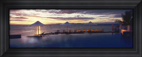 Framed Lounge chairs and patio umbrellas at a tourist resort, Matamanoa Island Resort, Mamanuca Islands, Fiji Print
