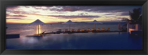 Framed Lounge chairs and patio umbrellas at a tourist resort, Matamanoa Island Resort, Mamanuca Islands, Fiji Print