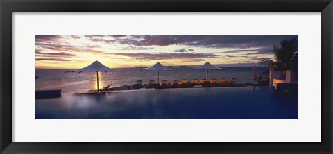 Framed Lounge chairs and patio umbrellas at a tourist resort, Matamanoa Island Resort, Mamanuca Islands, Fiji Print