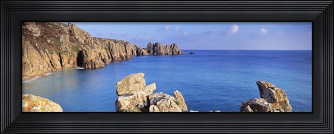 Framed Rock formations at seaside, Logan rock, Porthcurno Bay, Cornwall, England Print