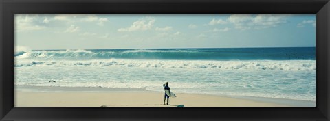 Framed Surfer standing on the beach, North Shore, Oahu, Hawaii Print