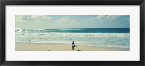 Framed Surfer standing on the beach, North Shore, Oahu, Hawaii Print