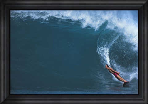 Framed Man surfing in the sea Print