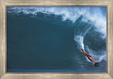 Framed Man surfing in the sea Print