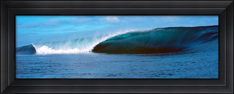 Framed Small waves in a dark blue sea Print