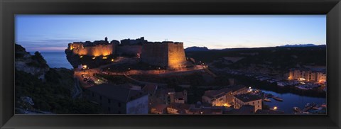Framed Castle lit up at night, Bonifacio Harbour, Corsica, France Print