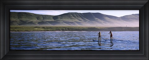 Framed Tourists paddleboarding in the pacific ocean, Santa Cruz Island, Santa Barbara County, California Print