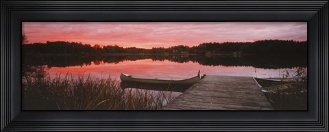 Framed Canoe tied to dock on a small lake at sunset, Sweden Print