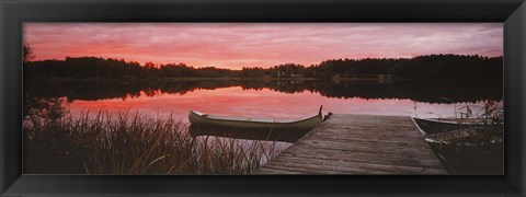 Framed Canoe tied to dock on a small lake at sunset, Sweden Print