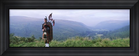 Framed Bagpiper at Loch Broom in Scottish highlands, Ross and Cromarty, Scotland Print
