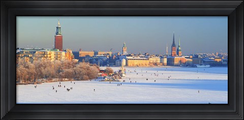 Framed People strolling across frozen Riddarfjarden, Riddarholmen, Stockholm, Sweden Print