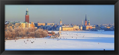 Framed People strolling across frozen Riddarfjarden, Riddarholmen, Stockholm, Sweden Print