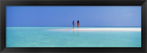 Framed Two women standing on the beach sandbar, Maayafushi Island, Ari Atoll, Maldives Print