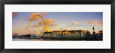 Framed Ferris wheel with buildings at waterfront, Millennium Wheel, London County Hall, Thames River, South Bank, London, England Print