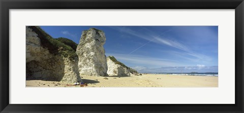 Framed Rock formations on the beach, White Rock Bay, Portrush, County Antrim, Northern Ireland Print