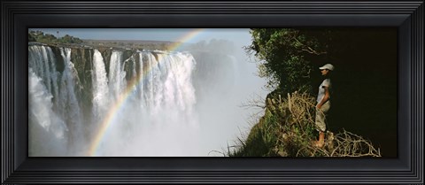 Framed Woman looking at a rainbow over the Victoria Falls, Zimbabwe Print