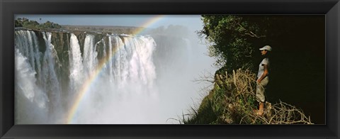 Framed Woman looking at a rainbow over the Victoria Falls, Zimbabwe Print