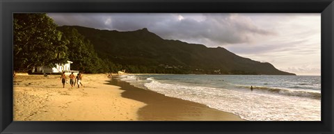 Framed People walking along the Beau Vallon beach, Mahe Island, Seychelles Print