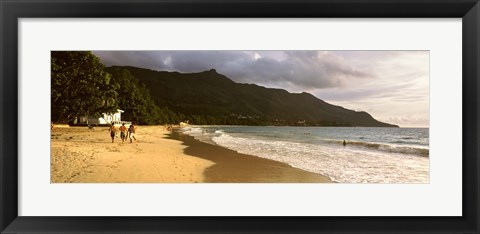 Framed People walking along the Beau Vallon beach, Mahe Island, Seychelles Print