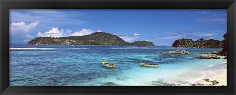 Framed Small fishing boats on Anse L&#39;Islette with Therese Island in background, Seychelles Print