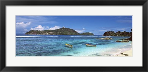 Framed Small fishing boats on Anse L&#39;Islette with Therese Island in background, Seychelles Print