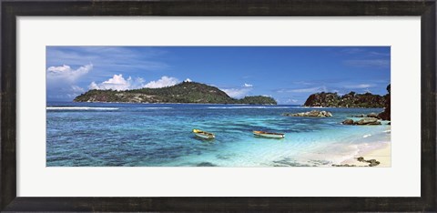 Framed Small fishing boats on Anse L&#39;Islette with Therese Island in background, Seychelles Print