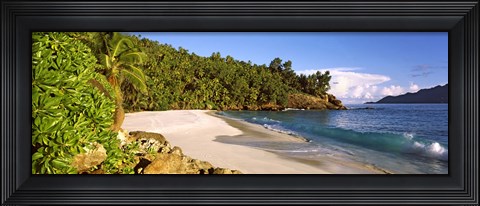 Framed Waves breaking on a small secluded beach on North Island, Seychelles Print