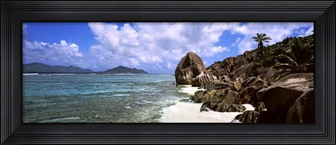 Framed Rock formations on the beach on Anse Source d&#39;Argent beach with Praslin Island in the background, La Digue Island, Seychelles Print