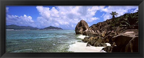 Framed Rock formations on the beach on Anse Source d&#39;Argent beach with Praslin Island in the background, La Digue Island, Seychelles Print