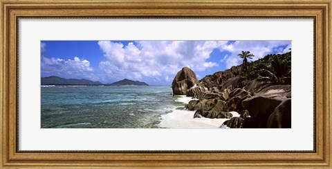 Framed Rock formations on the beach on Anse Source d&#39;Argent beach with Praslin Island in the background, La Digue Island, Seychelles Print