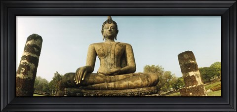 Framed Low angle view of a statue of Buddha, Sukhothai Historical Park, Sukhothai, Thailand Print