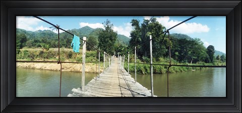 Framed Old wooden bridge across the river, Chiang Mai Province, Thailand Print