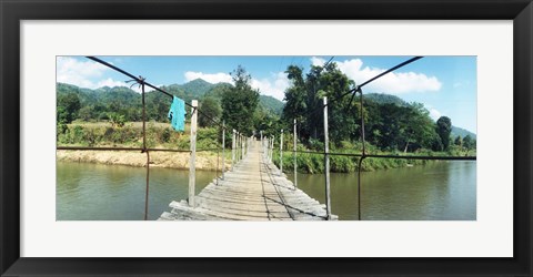 Framed Old wooden bridge across the river, Chiang Mai Province, Thailand Print