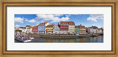 Framed Tourists in a tourboat with buildings along a canal, Nyhavn, Copenhagen, Denmark Print