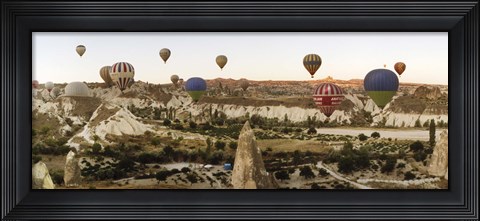 Framed Mulit colored hot air balloons at sunrise over Cappadocia, Central Anatolia Region, Turkey Print