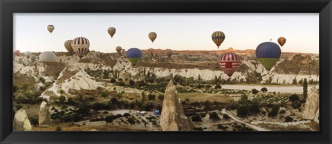 Framed Mulit colored hot air balloons at sunrise over Cappadocia, Central Anatolia Region, Turkey Print