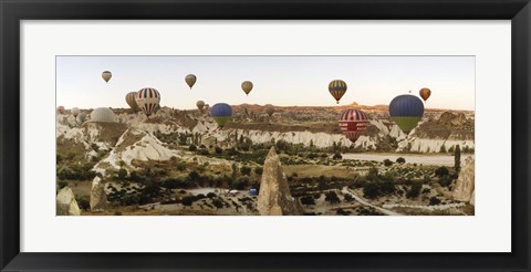 Framed Mulit colored hot air balloons at sunrise over Cappadocia, Central Anatolia Region, Turkey Print