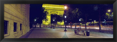 Framed France, Paris, Arc de Triomphe lit up at night Print