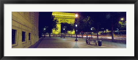 Framed France, Paris, Arc de Triomphe lit up at night Print