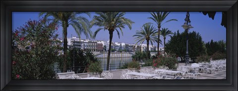 Framed Sidewalk cafe at the riverside, Guadalquivir River, Seville, Spain Print