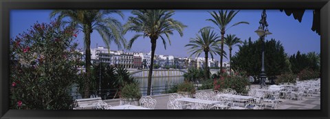 Framed Sidewalk cafe at the riverside, Guadalquivir River, Seville, Spain Print