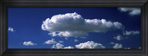 Framed Fluffy clouds in blue sky Print