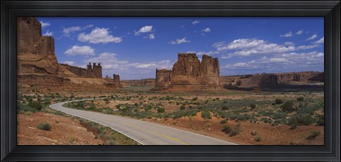 Framed Empty road running through a national park, Arches National Park, Utah, USA Print