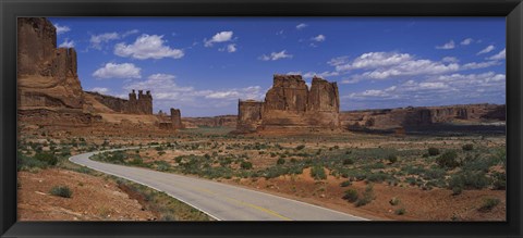 Framed Empty road running through a national park, Arches National Park, Utah, USA Print