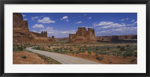 Framed Empty road running through a national park, Arches National Park, Utah, USA Print